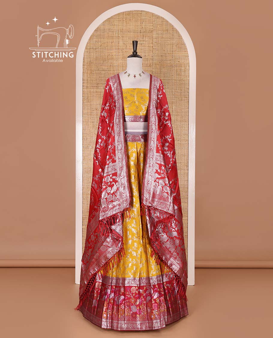 Haldi yellow taffeta silk half saree, floral jaal jacquard skirt, contrast magenta zari meenakari style bird border, matching blouse, and floral jaal dhavani
