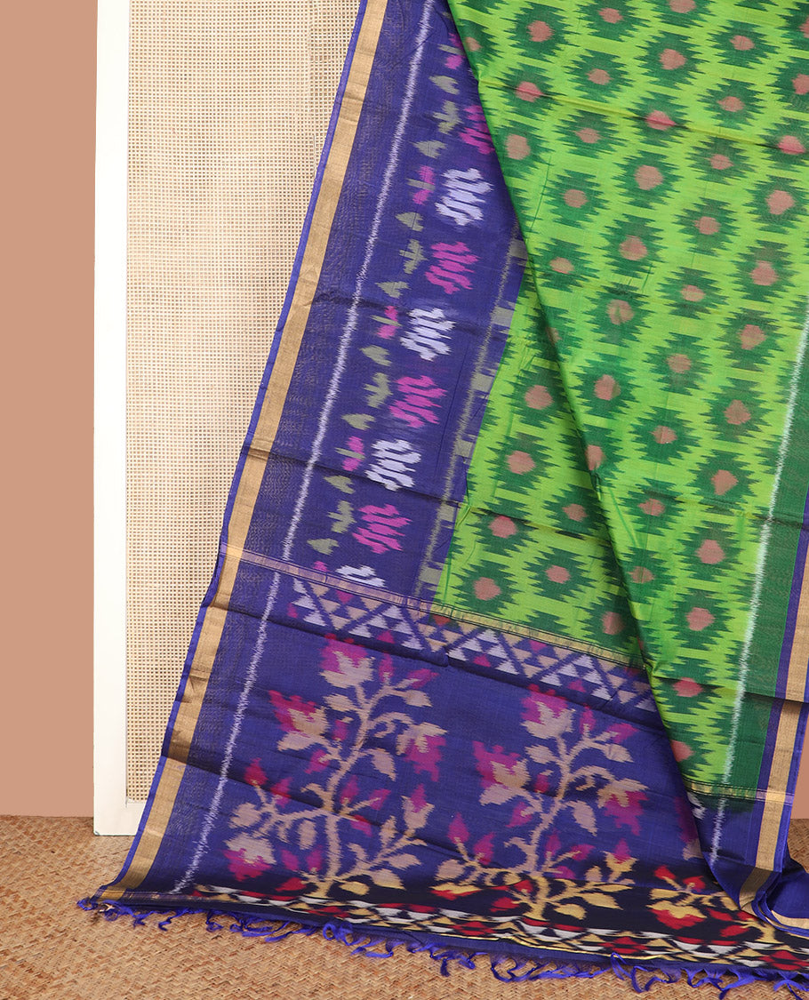Green Ikkat Cotton Saree, Embellished with Ikkat-Style Buttas All Over Its Body, Complemented by a Contrast Border of Lotus Motifs in Ikkat-Style Weave, Pallu of Floral Designs in Ikkat Weave, and Paired with a Contrast Blouse