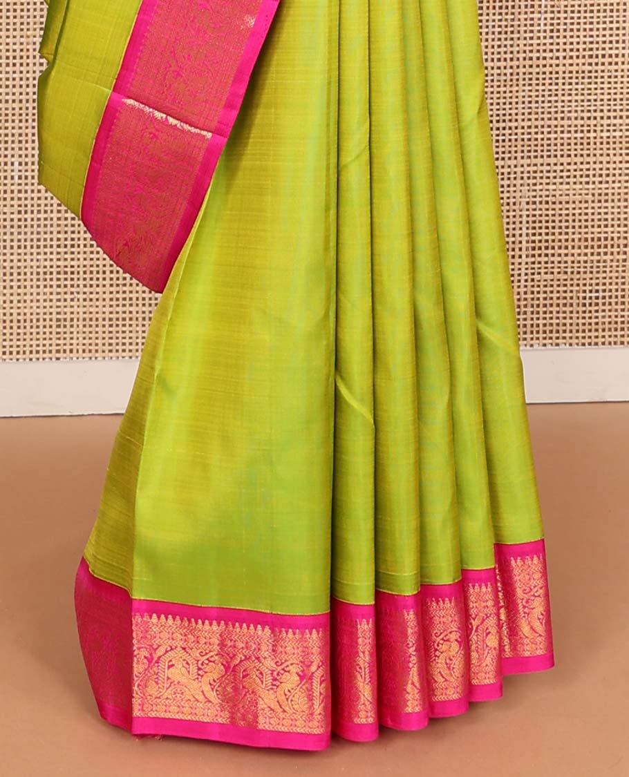 Green plain Kanchipuram korvai silk saree, contrast neer korvai border of thilakam mokku, kathir, poun, and mayil kann designs, and jaal pallu