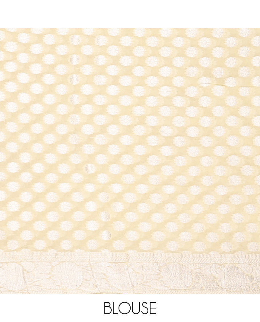 Pale yellow floral jacquard semi-banaras crepe saree, floral creeper border & intricate pallu