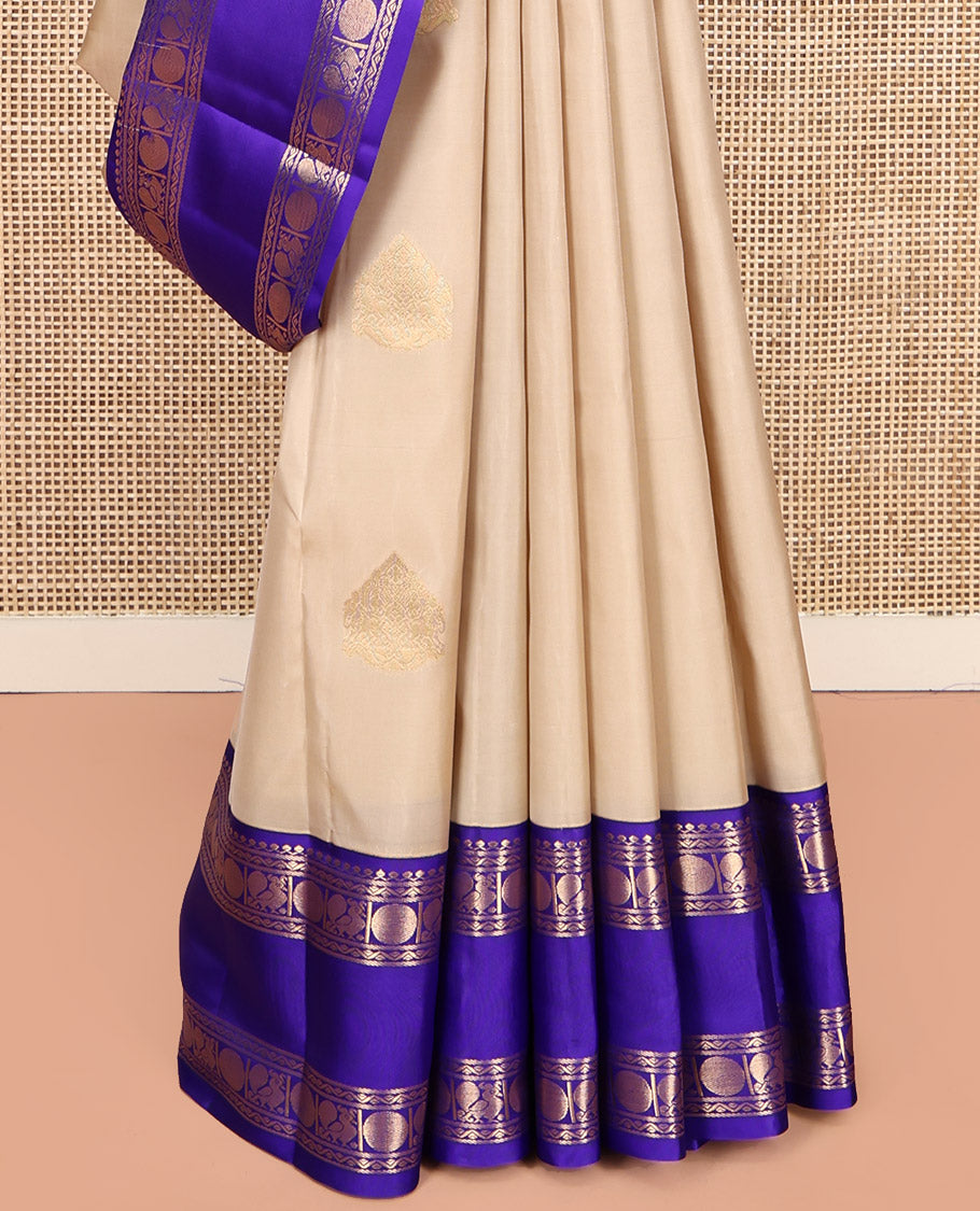 Cream Vasundhara Lite Silk Mix Saree, Subtly Sparkled with Zari Buttas, a Contrast Rettai Pettu Border of Thilakam Mokku, Neli, Mayil, and Poun, Intricate Pallu, and a Contrast Blouse