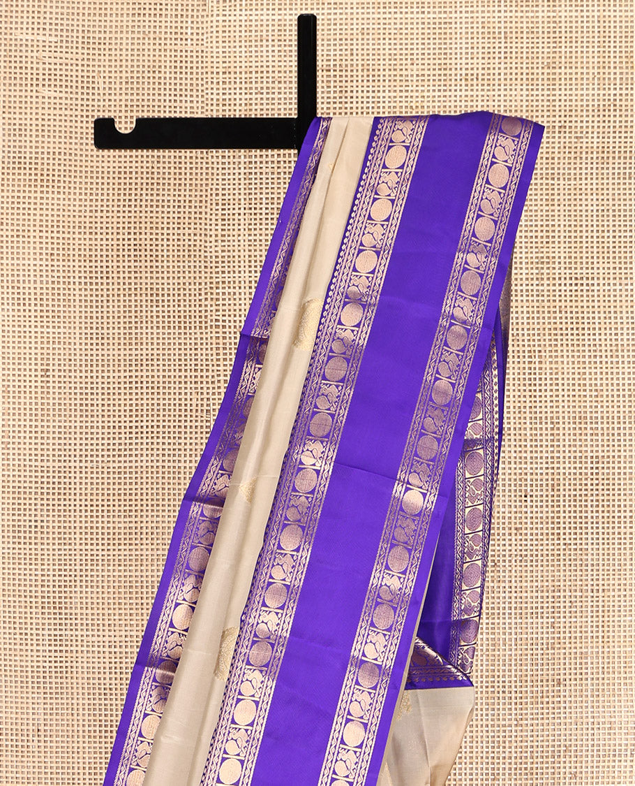 Cream Vasundhara Lite Silk Mix Saree, Subtly Sparkled with Zari Buttas, a Contrast Rettai Pettu Border of Thilakam Mokku, Neli, Mayil, and Poun, Intricate Pallu, and a Contrast Blouse