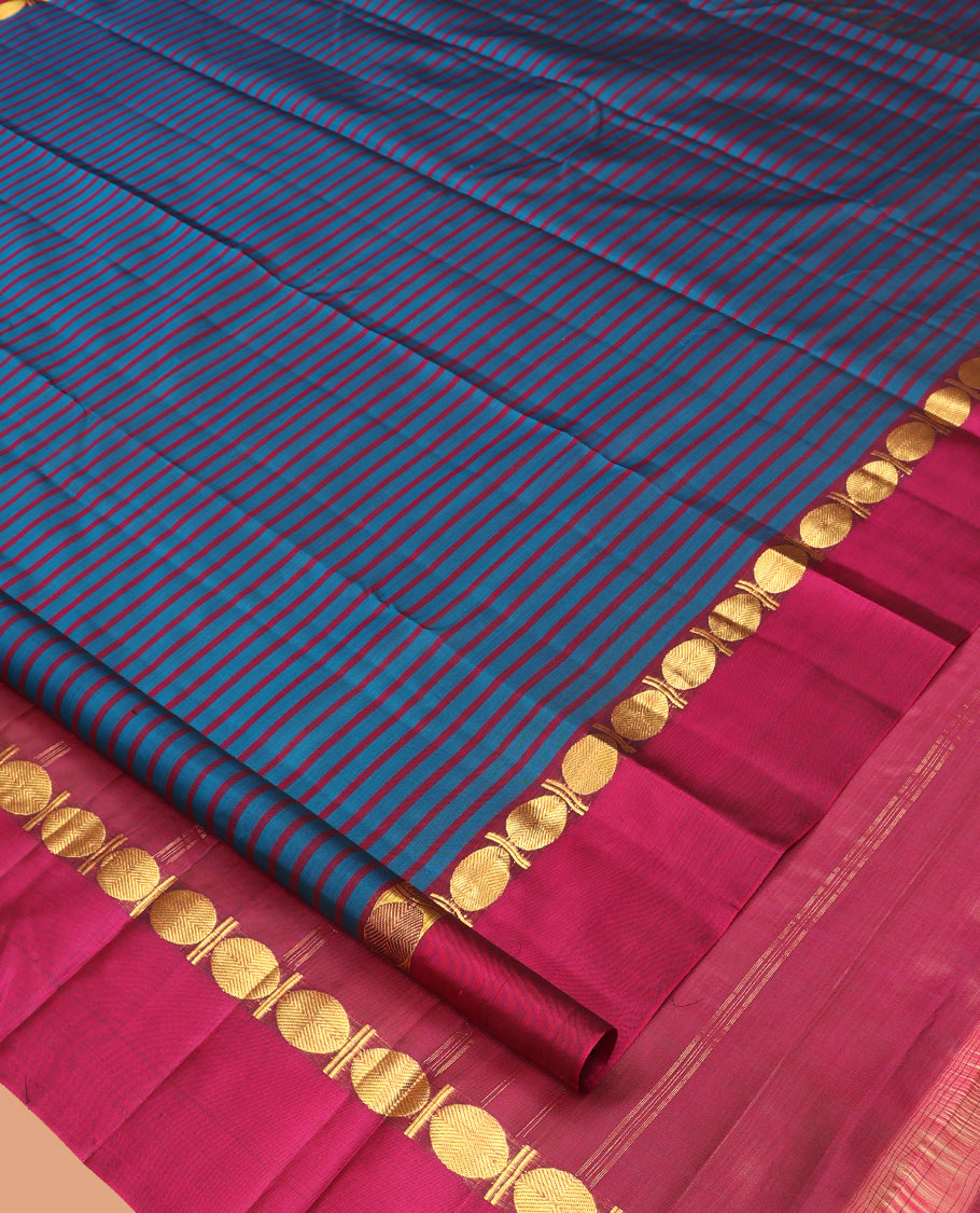 Blue Striped Kanchipuram Silk Saree, Complemented by a Contrast Kal Eragina Border of Rudraskham Design, Pallu of Zari Design, and a Contrast Blouse
