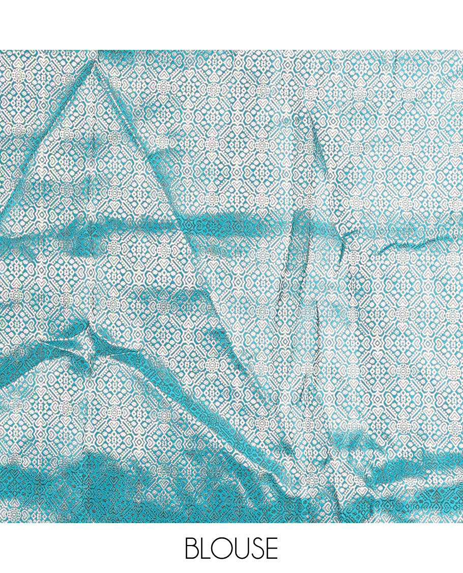 Cream with rama green semi-banarasi half-saree, zari buttas with contrast traditional zari border skirt, zari jacquard blouse, and zari design dhavani