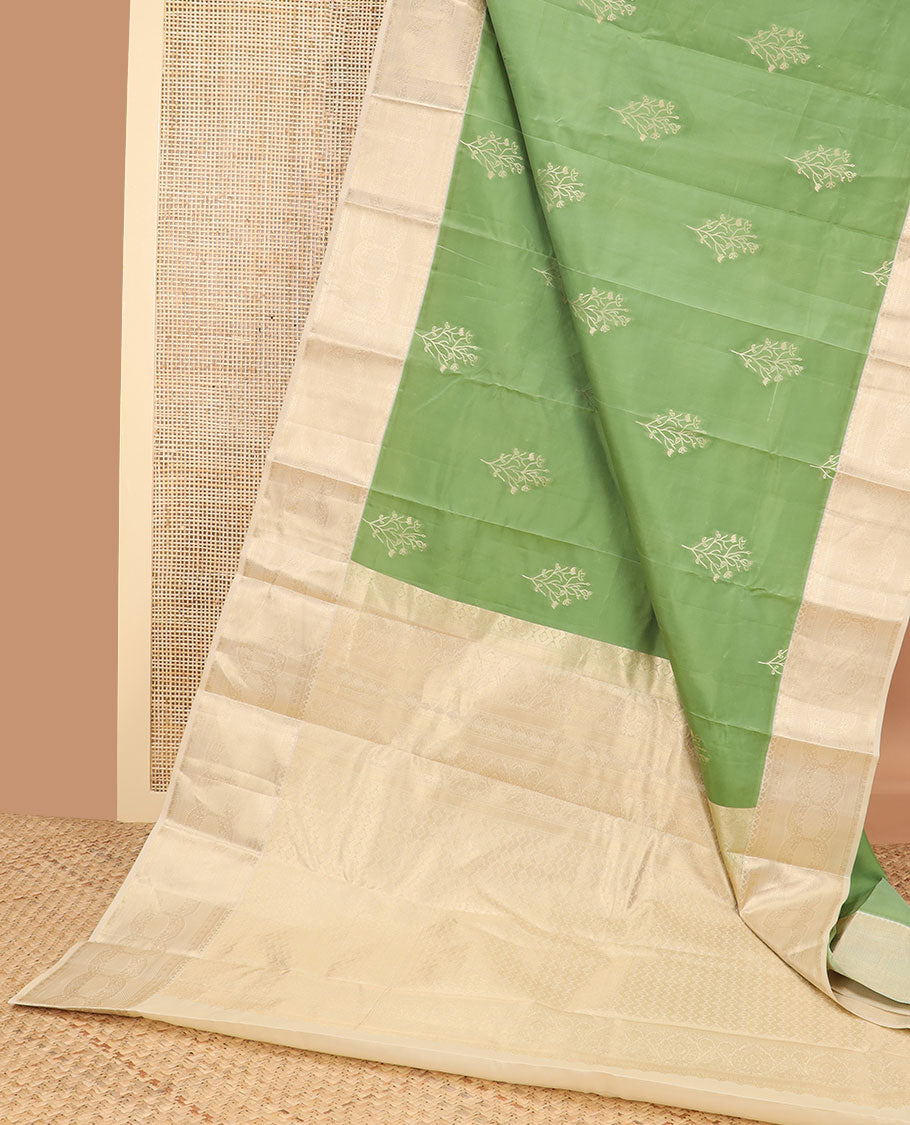 Green buttas vasundhara elite silk saree with contrast floral design border & intricate zari design pallu