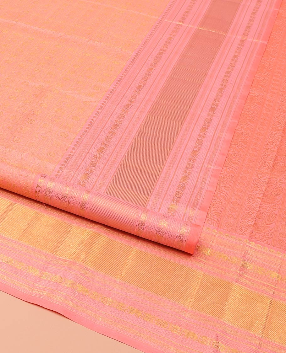 Pink Kanchipuram Wedding Silk Saree, Detailed with Jacquard Design on Its Body, Highlighted by Zari Border of Thilakam Mokku, Muthu, Mayil Kann, Yaanai, and Chakram Designs, Pallu of Mayil Kann Designs, and Paired with a Matching Blouse