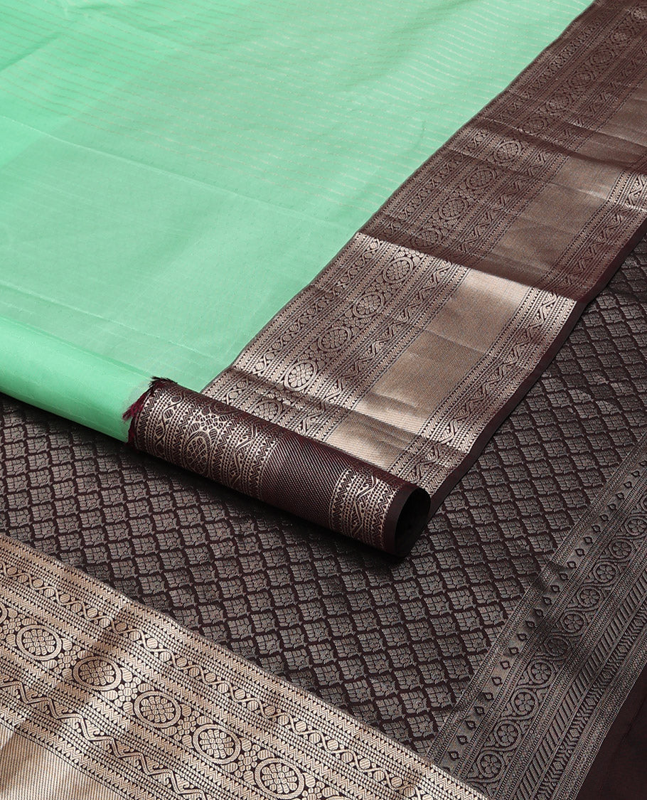 Mint green sriped vasundhara elite silk saree with contrast intricate zari design border & floral jaal design pallu