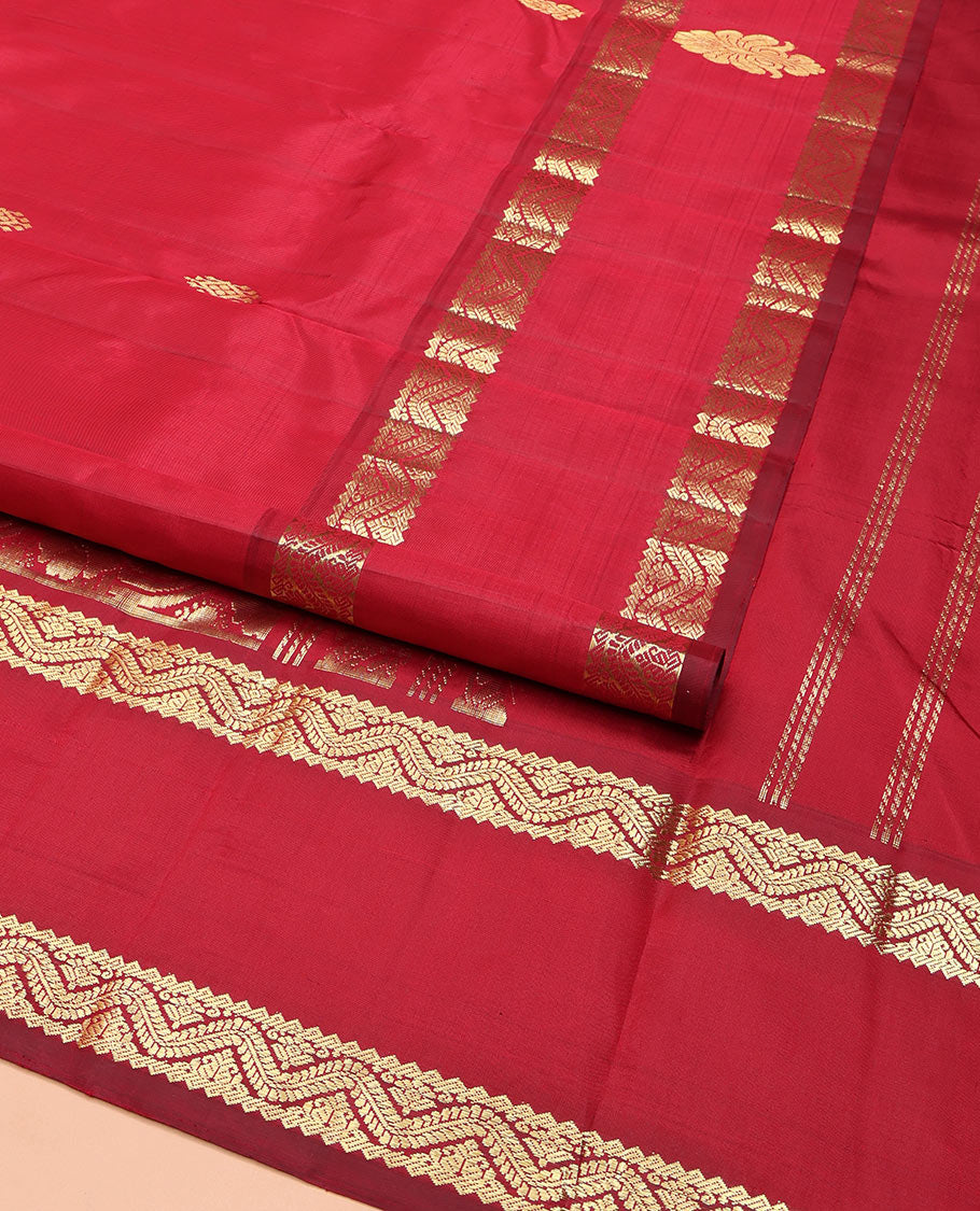 Red Kanchipuram Silk Saree, Beautified with Zari Buttas, Highlighted by Rettai Pettu Traditional Zari Motifs Woven Border, Pallu Features Floral Designs, and Comes Without a Blouse