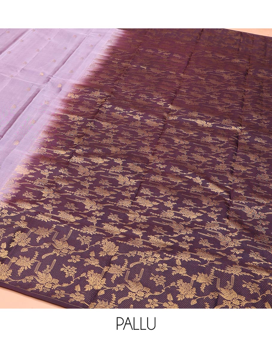 Lavender Vasundhara Silk Saree, Ornamented with Zari Buttas on Its Body, Complemented by Contrast Zari Border of Floral Jaal Designs, Gracefully Embellished Pallu of Floral Jaal Designs, and Paired with a Contrast Blouse