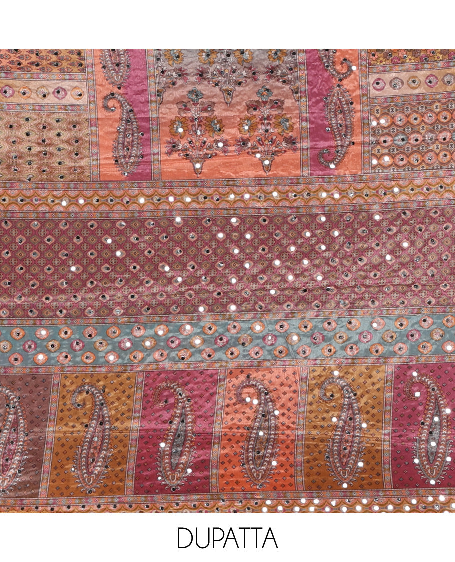 Mustard churidar material set, Ajrakh-printed neck with Schiffli embroidery & mirror work georgette top, kalidoscopic-colored dupatta of ajrakh print & mirror embroidery & plain crepe bottom