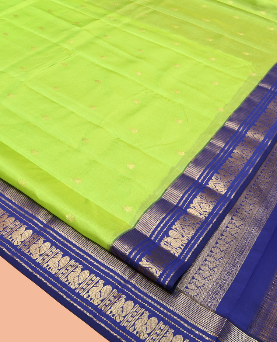 Green Vasundhara Lite Silk Mix Saree, Sparsely Sparkled with Zari Buttas, Complemented by a Contrast Zari Border of Mayil Design, Pallu of Mayil Designs, and a Contrast Blouse