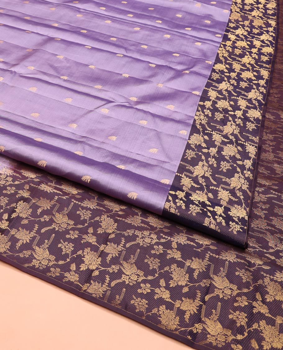 Lavender Vasundhara Silk Saree, Ornamented with Zari Buttas on Its Body, Complemented by Contrast Zari Border of Floral Jaal Designs, Gracefully Embellished Pallu of Floral Jaal Designs, and Paired with a Contrast Blouse