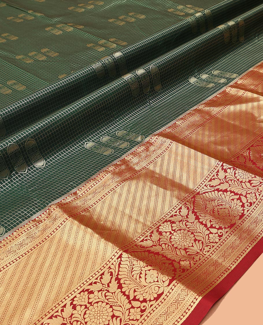 Green Art Silk Material Half Saree Set Featuring a Zari Buttas and Checked Skirt, a Contrast Traditional Zari Design Border, Contrast Blouse, and Zari Designs Dhavani