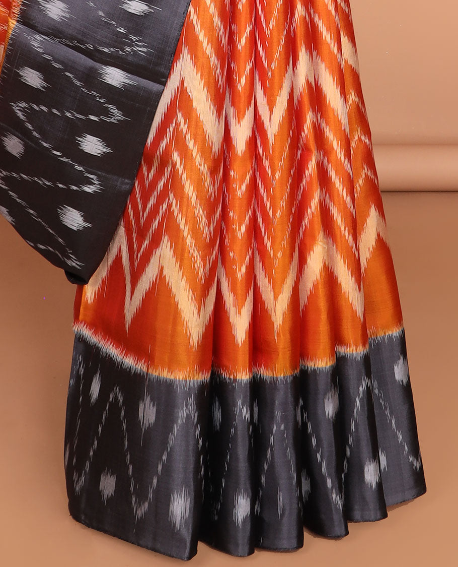 Orange ikkat-style chevron striped soft silk saree, contrast border & pallu of ikkat designs