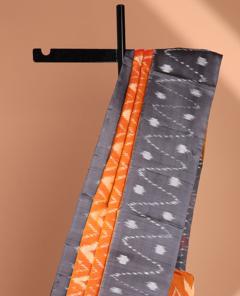 Orange ikkat-style chevron striped soft silk saree, contrast border & pallu of ikkat designs