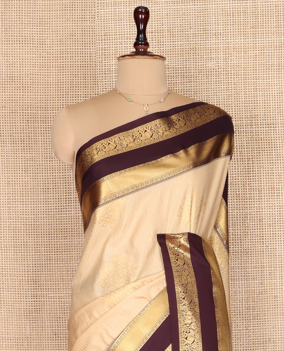 Sandal Budget Silk Saree, Embellished with Zari Stripes and Kolam Buttas All Over Its Body, Complemented by a Contrast Traditional Zari Design Rettai Pettu Border, Grand Scallop Design Pallu, and Paired with a Contrast Blouse