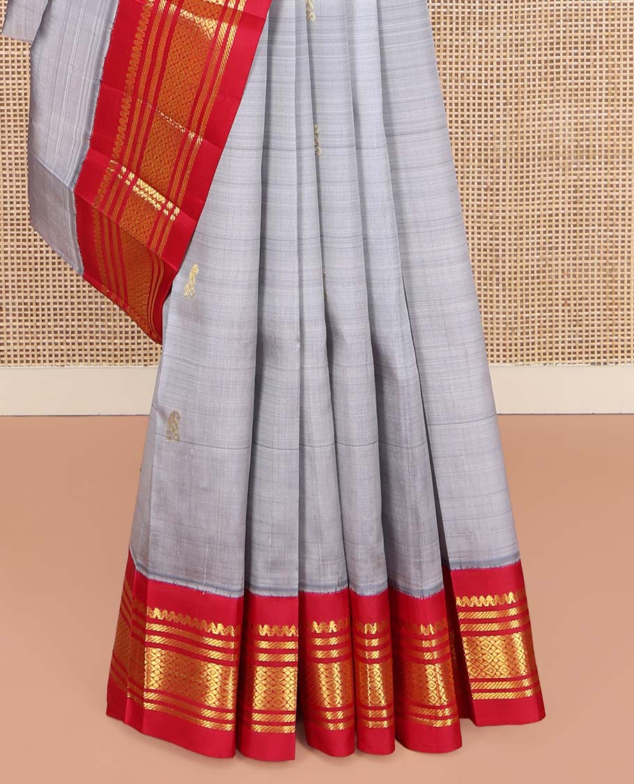 Grey Kanchipuram Silk Saree, Subtly Sparkled with Zari Buttas on Its Body, Complemented by a Contrast One-Sided Korvai Border of Salngai, Banaras, and Jaal Designs, Pallu Features Zari Designs, and Comes Without a Blouse