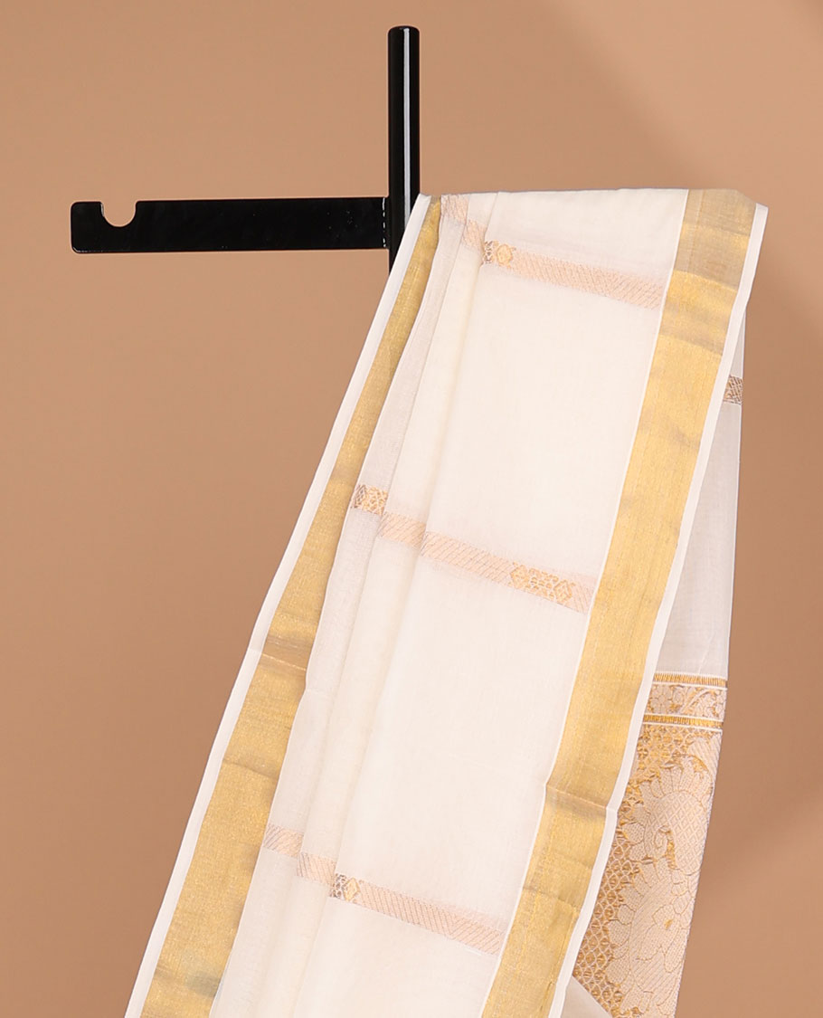 Cream kerala saree with zari stripes, zari border & pallu of intricate designs in zari