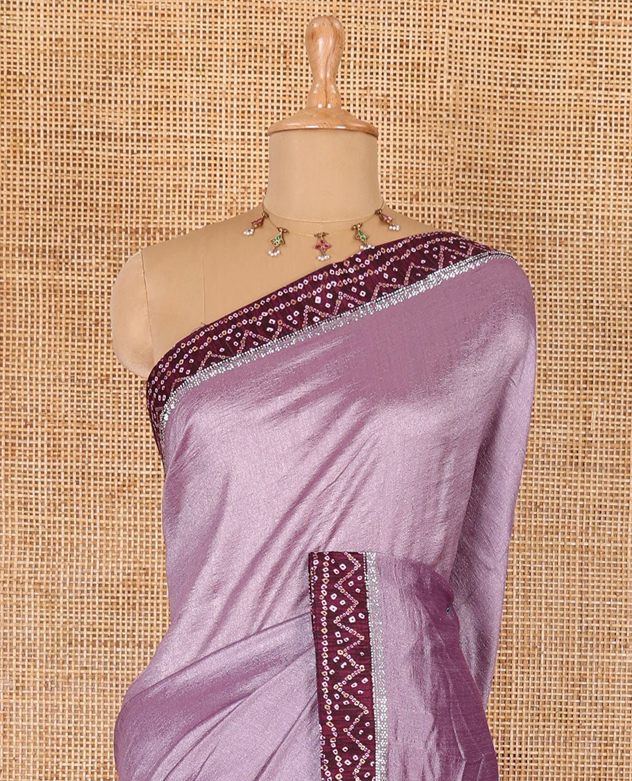 Lavender plain Vichitra silk saree, contrast bandhani printed with Swarovski micro-stonework border, and a contrast bandhani printed blouse
