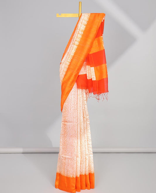 Cream abstract design matka silk saree with contrast plain border & orange abstract design pallu