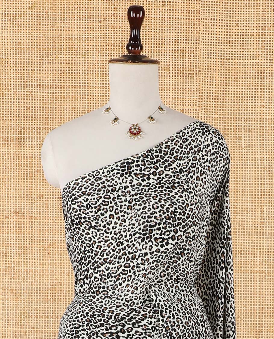 Borderless black and white color leopard-skin-theme animal printed crepe saree with printed blouse