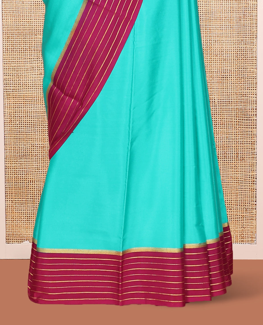 Green Plain Mysore Silk Saree, Complemented by Captivating Contrast Zari Striped Border, Pallu of Vibrant Zari Stripes and Paired with a Contrast Blouse