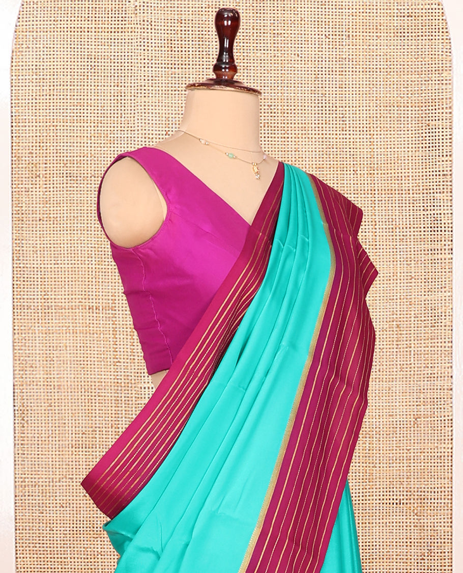 Green Plain Mysore Silk Saree, Complemented by Captivating Contrast Zari Striped Border, Pallu of Vibrant Zari Stripes and Paired with a Contrast Blouse