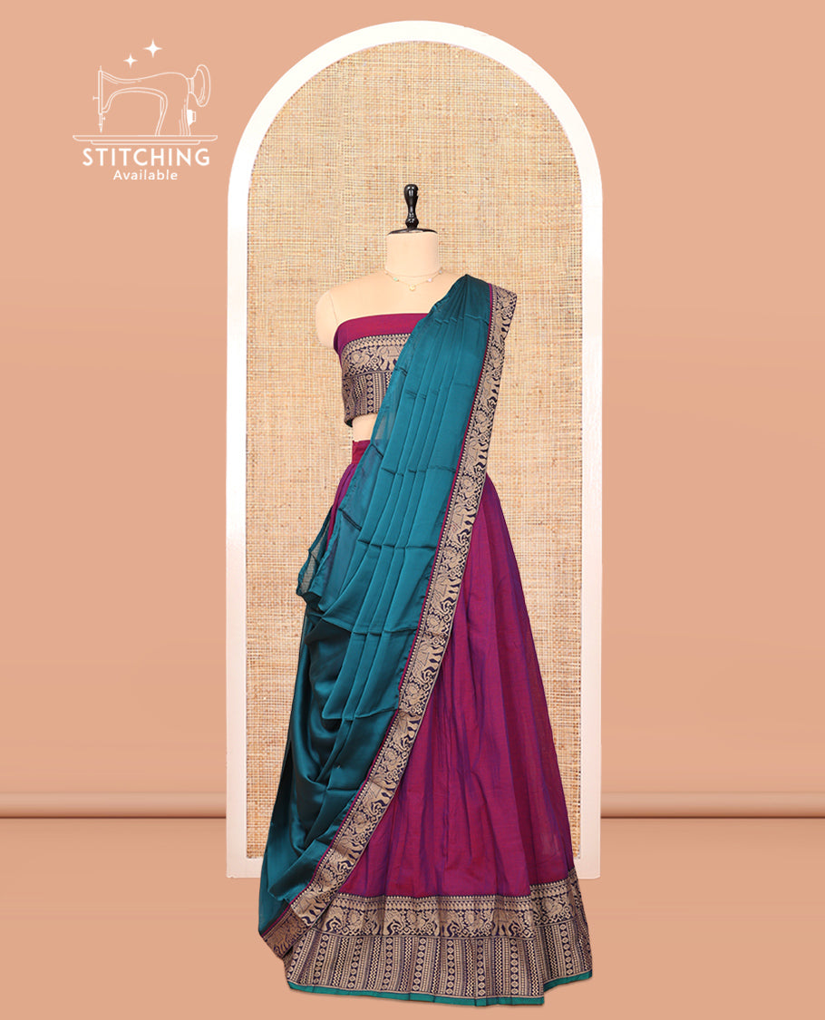 Purple Cotton Half-Saree Features Plain Skirt, a Contrast Traditional Thread Border, a Matching Blouse, and a Contrast Dhavani
