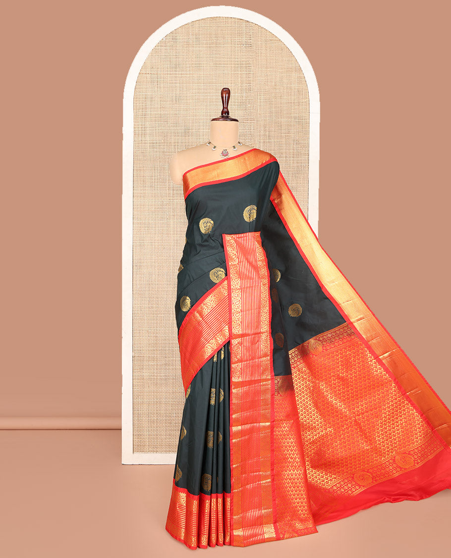 Dark Green Budget Silk Saree, Scintillated with Peacock Zari Buttas All Over Its Body, Complemented by Contrast Border of Paisley Designs, Gleaming Pallu of Jaal Designs, and Paired with a Contrast Blouse