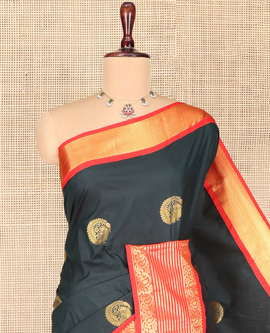 Dark Green Budget Silk Saree, Scintillated with Peacock Zari Buttas All Over Its Body, Complemented by Contrast Border of Paisley Designs, Gleaming Pallu of Jaal Designs, and Paired with a Contrast Blouse