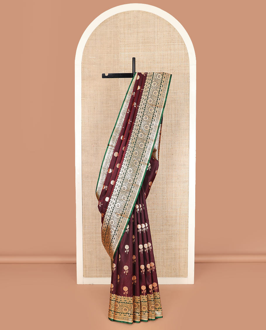 Maroon floral buttas banarasi silk saree, contrast floral creeper design border, and Mughal-style designs woven pallu