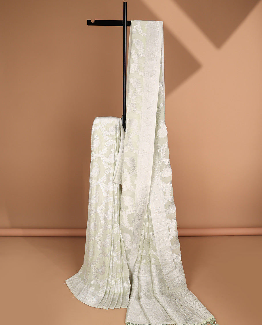 Green floral jacquard semi-banaras crepe saree, floral creeper border & intricate pallu