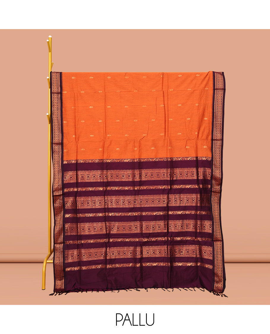 Orange Kalyani Cotton Saree, Graced with Buttas All Over Its Body, Complemented by a Contrast Traditional Zari Design Border, Pallu Features Traditional Zari Designs, and Paired with a Contrast Blouse