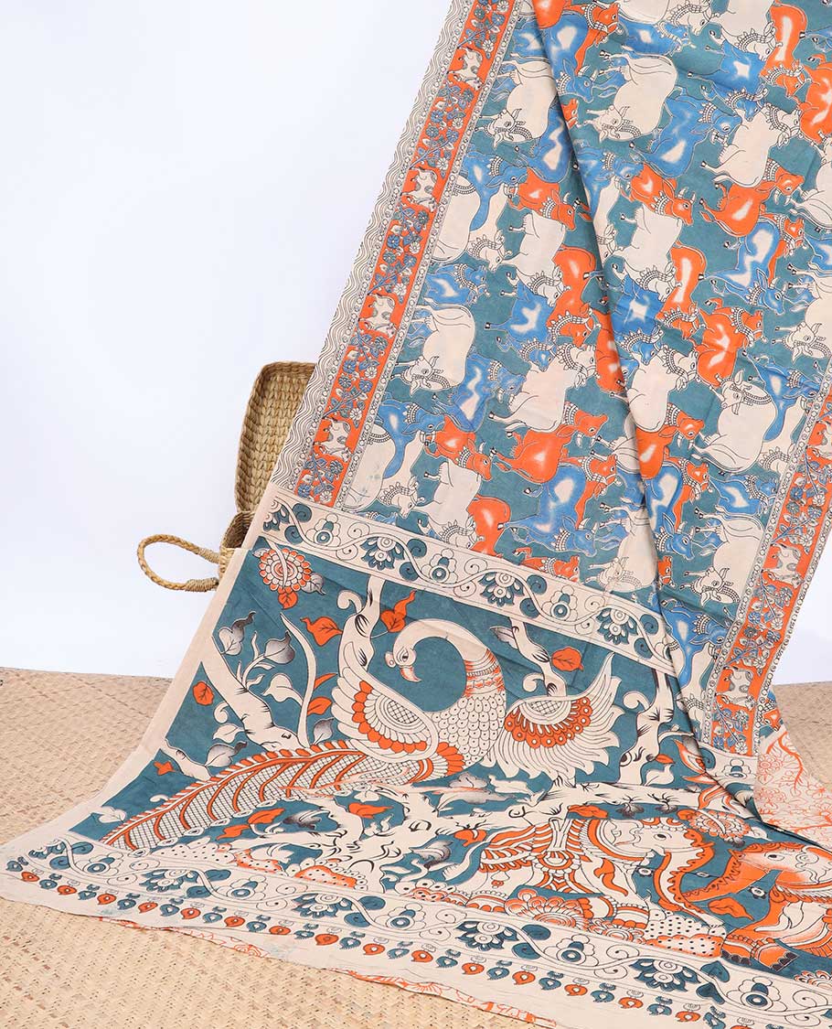 Blue Pichwai cow machine-printed kalamkari cotton saree wth uniquely printed border & animal motifs pallu
