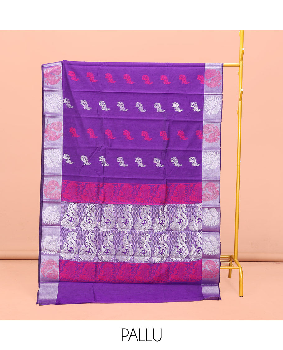Violet Semi-Silk Cotton Saree, Embellished with Peacock Buttas All Over Its Body, Complemented by a Contrast Border of Peacock Designs, Pallu Steeped with Peacock Zari Design, and Paired with a Matching Blouse