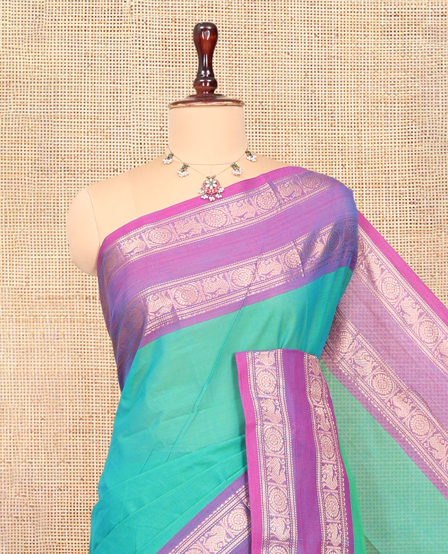 Aqua Green Chettinad Plain Cotton Saree, Defined by a Contrast Rettai Pettu Yaazhi-Chakra Border, a Striped Pallu and a Matching Blouse