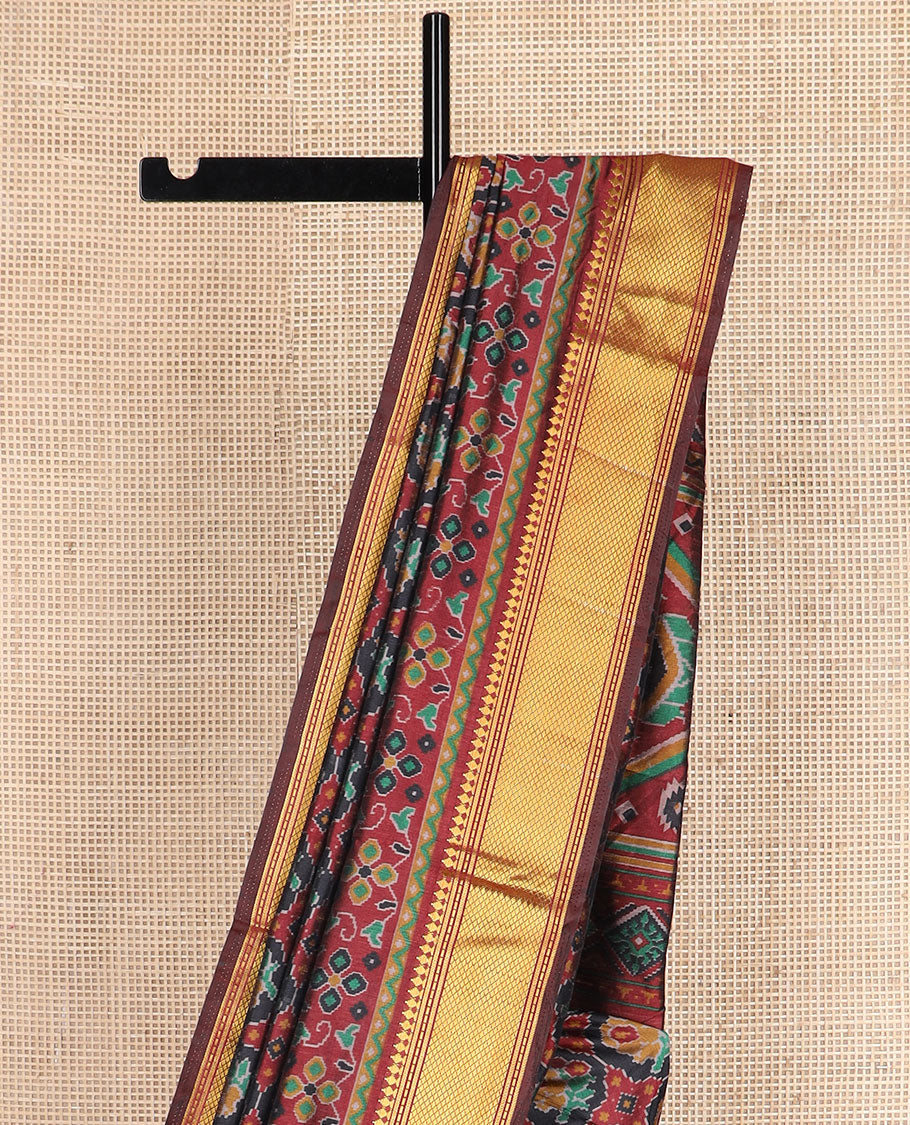 Black ikkat design semi-banaras patola silk saree, traditional zari design border, and ikkat design pallu