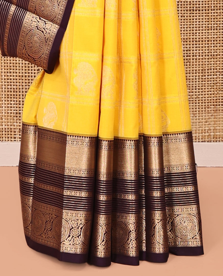 Lemon Yellow-Coffee Brown Budget Silk Saree, Subtly Sparkled With Zari Butta Enclosed Checks On Its Body, Complemented by Contrast Traditional Zari Designs Woven Border of Chakram Design, Jaal Pallu and Paired with a Contrast Blouse
