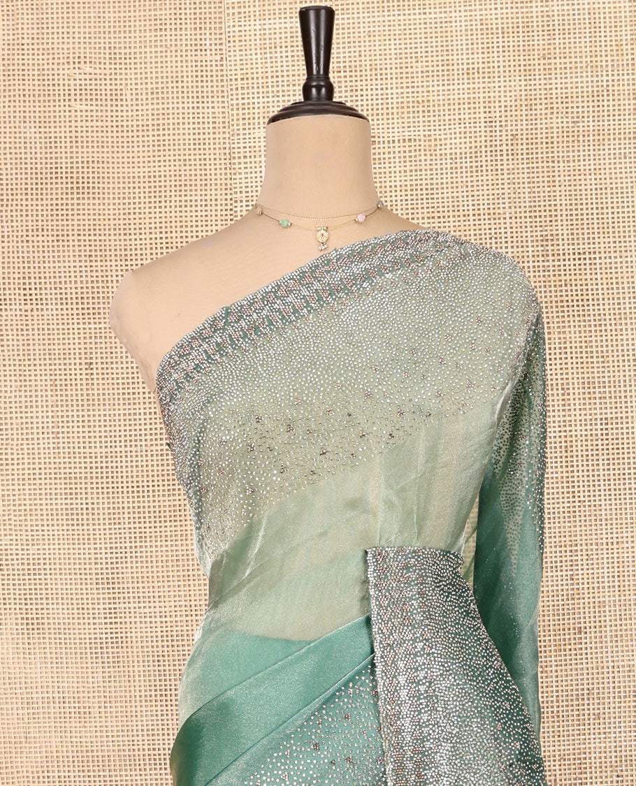 Emerald Green Fendi Silk Saree with Swarovski Stonework Border, and a Stonework Blouse