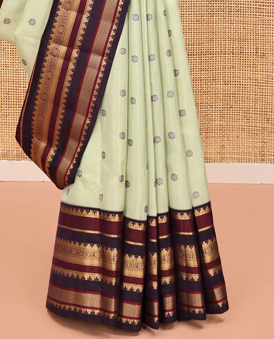 Pista Green and Coffee Brown Vasundenhara Lite Silk Mix Saree, Subtly Adorned with Buttas All Over Its Body, Complemted by Contrast Border of Thazampoo Rekku, Banaras, Jada Nagam, and Ara Maadam Designs, Grand Pallu, and Paired with a Contrast Blouse