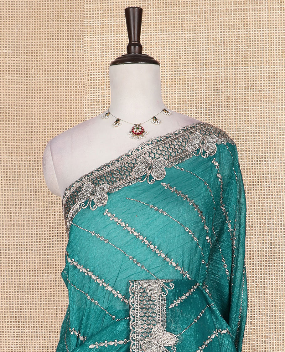 Green diagonal vine stone and thread embroidered designer saree, butterfly scallop embroidered border, and pallu