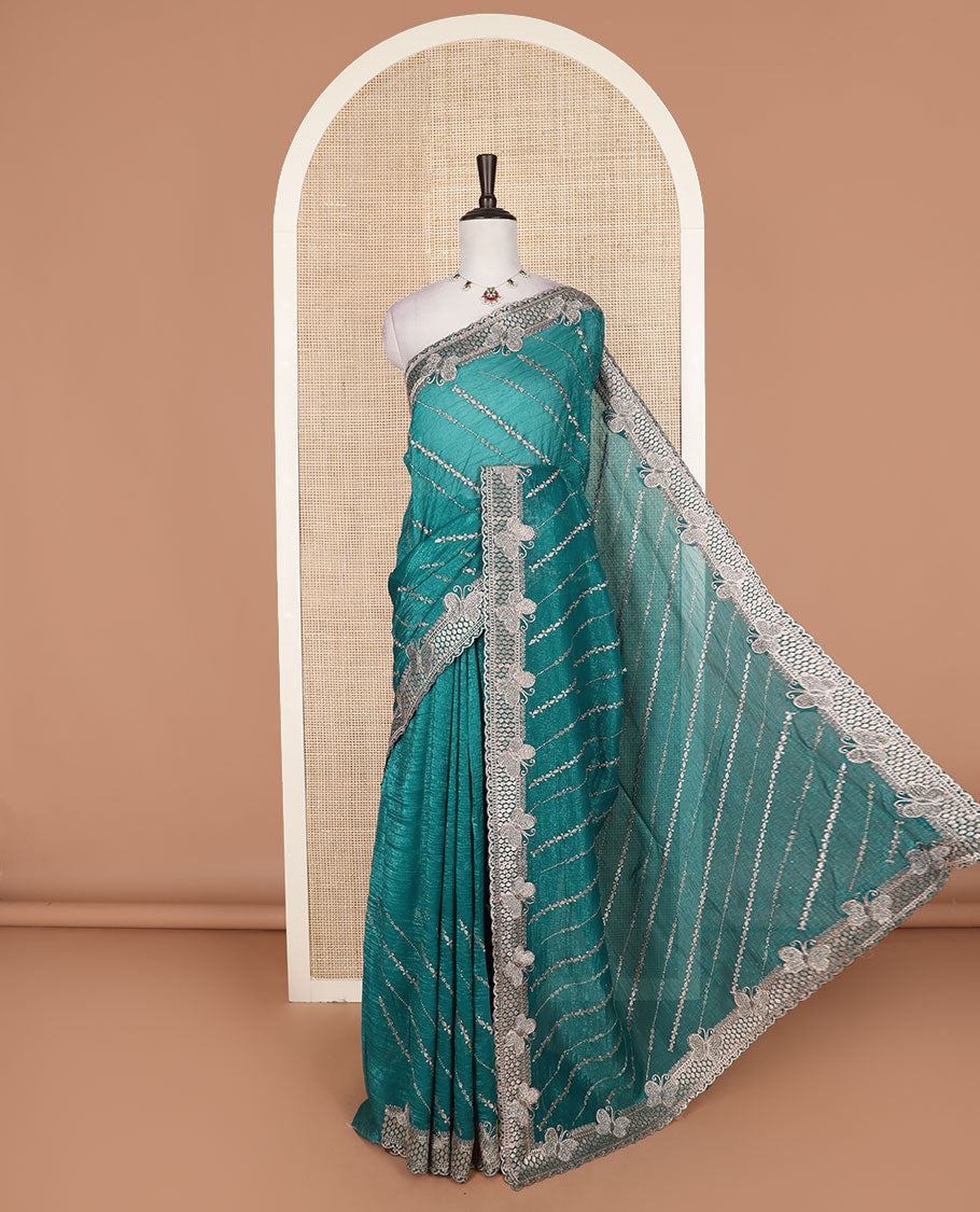 Green diagonal vine stone and thread embroidered designer saree, butterfly scallop embroidered border, and pallu