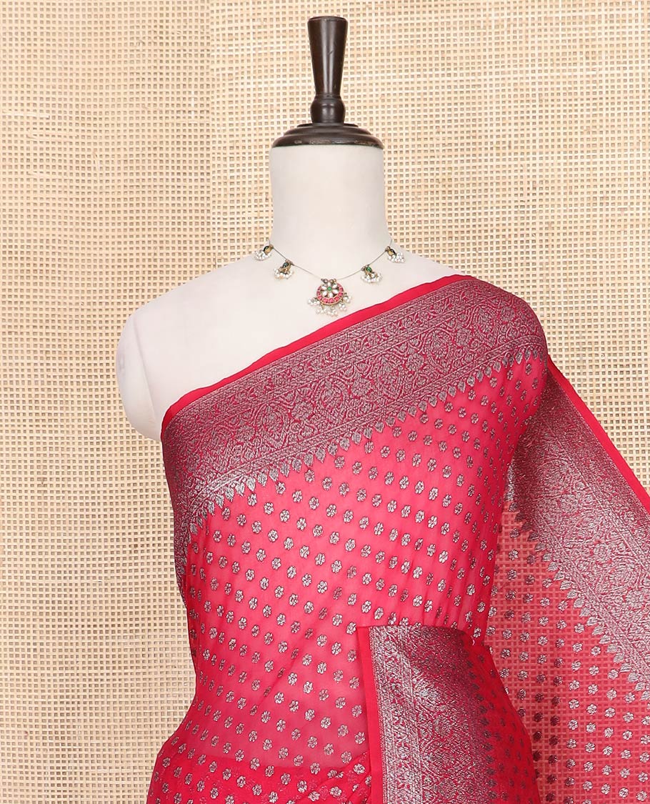 Red Fancy Georgette Saree Mesmerized with Zari Buttas, Highlighted by a Traditional Zari Design Border, Grandly Woven Pallu Featuring Floral Zari Designs, and Paired with a Matching Blouse