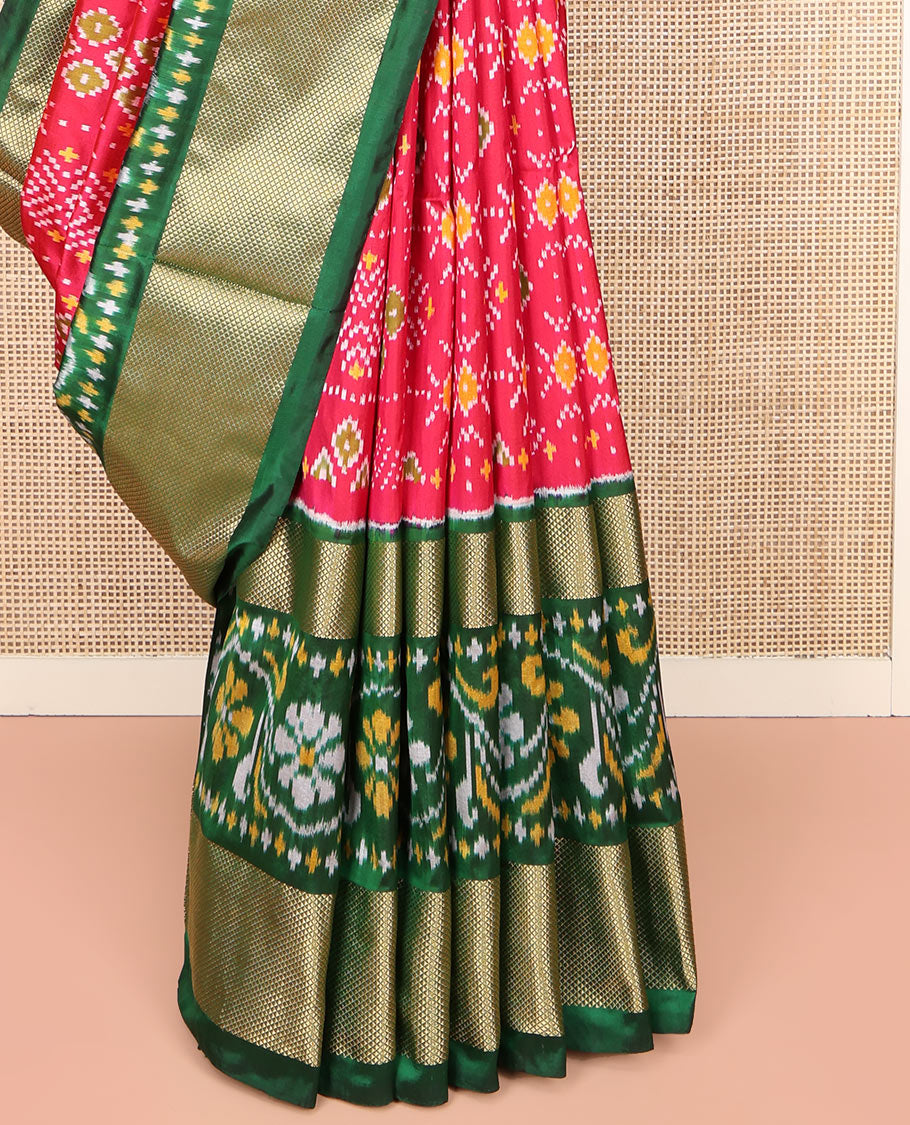 Red Ikkat Silk Saree, Ornamented with Ikkat Buttas Enclosed Checks All Over Its Body, Complemented by a Contrast Border of Floral Creeper Ikkat and Diamond Zari Designs, Pallu of Floral Creeper Designs, and Paired with a Matching Blouse