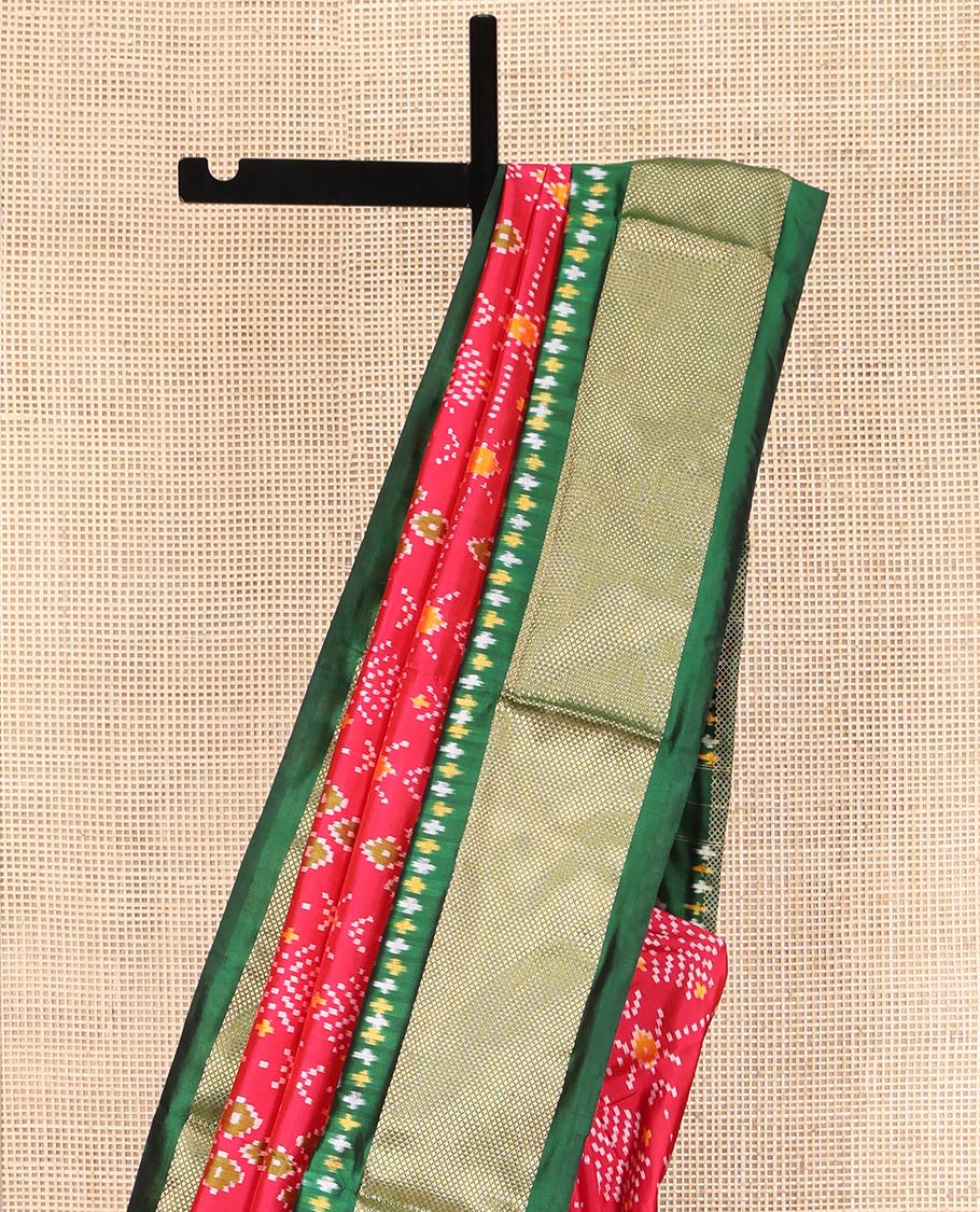 Red Ikkat Silk Saree, Ornamented with Ikkat Buttas Enclosed Checks All Over Its Body, Complemented by a Contrast Border of Floral Creeper Ikkat and Diamond Zari Designs, Pallu of Floral Creeper Designs, and Paired with a Matching Blouse