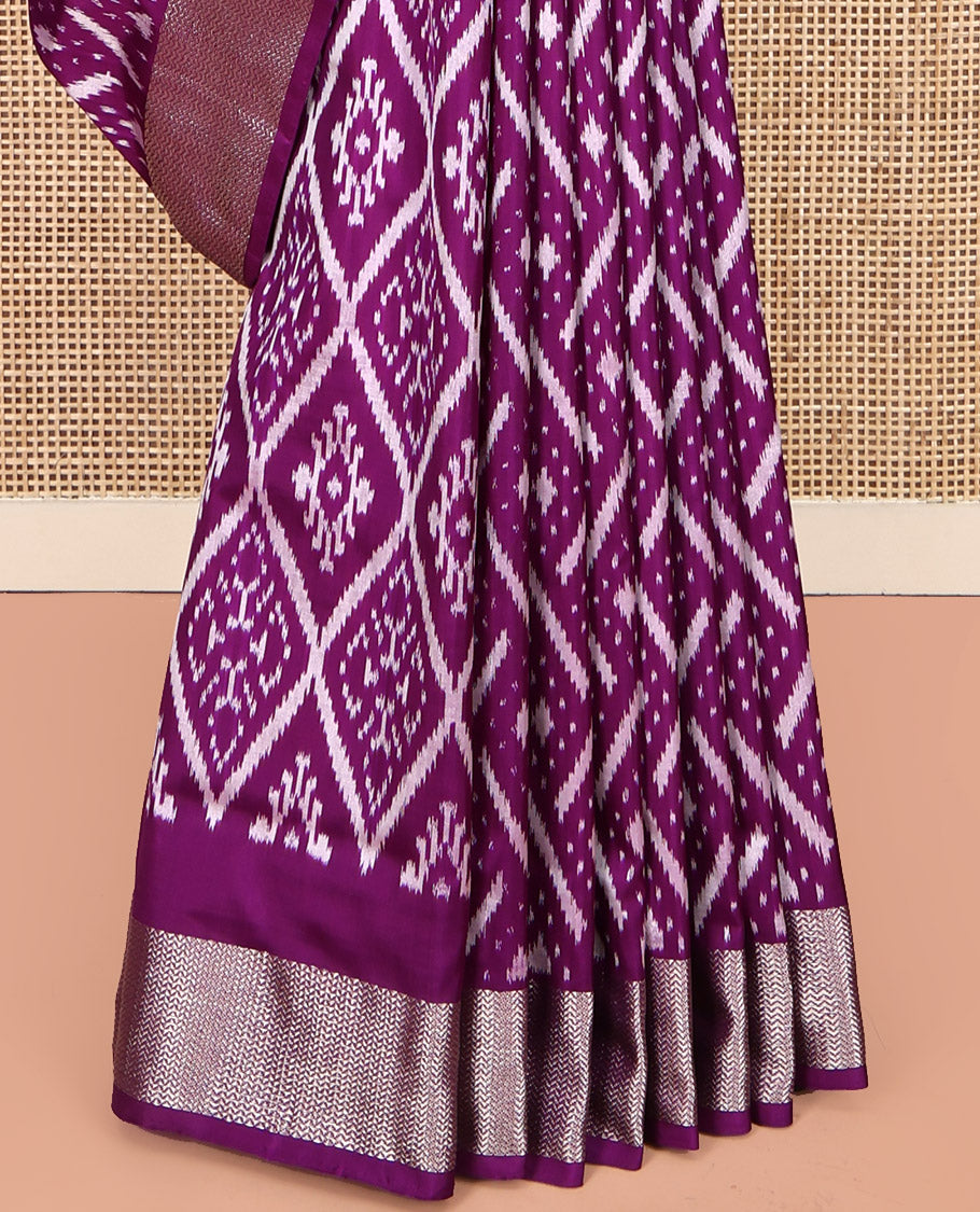 Purple Pochampally Ikat Silk Saree, Accentuated with Ikat Geometric Designs on Its Body, Highlighted by a Zari Chevron Border, Pallu of Ogee Pattern in Ikkat Weave, and Paired with a Matching Blouse