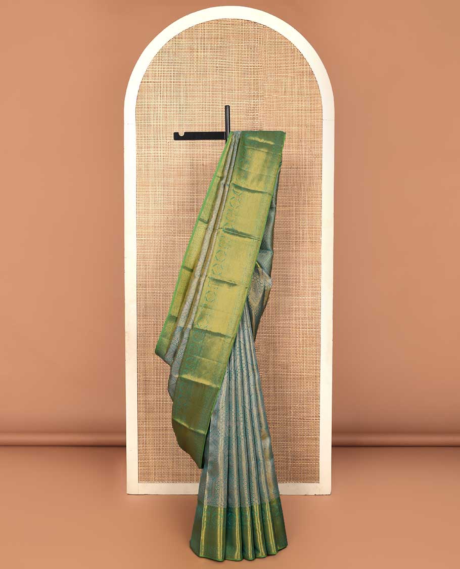 Blue jacquard Kanchipuram silk saree, contrast border of thilakam mokku, mayil, diamond, kodi visiry, and zari stripes, and zari-rich jaal pallu