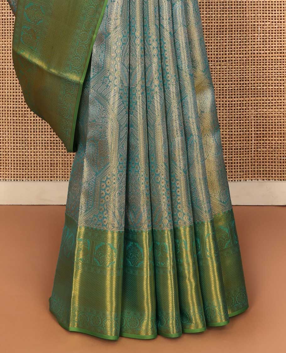 Blue jacquard Kanchipuram silk saree, contrast border of thilakam mokku, mayil, diamond, kodi visiry, and zari stripes, and zari-rich jaal pallu