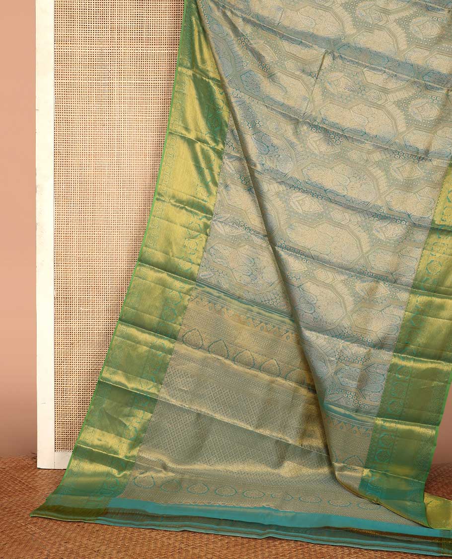 Blue jacquard Kanchipuram silk saree, contrast border of thilakam mokku, mayil, diamond, kodi visiry, and zari stripes, and zari-rich jaal pallu