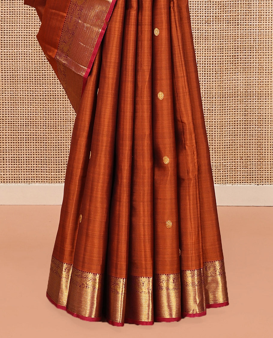 Orange Kanchipuram Silk Saree, Detailed with Chakram Buttas All Over Its Body, Complemented by Contrast Border of Rekku, Muthu, Mayil, and Yaali Designs, Pallu of Kodi Visiry and Lavangam Designs, and Paired with a Contrast Blouse